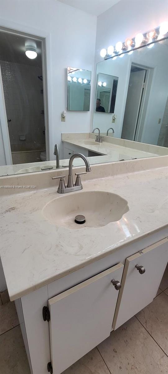 bathroom featuring tile patterned floors and vanity