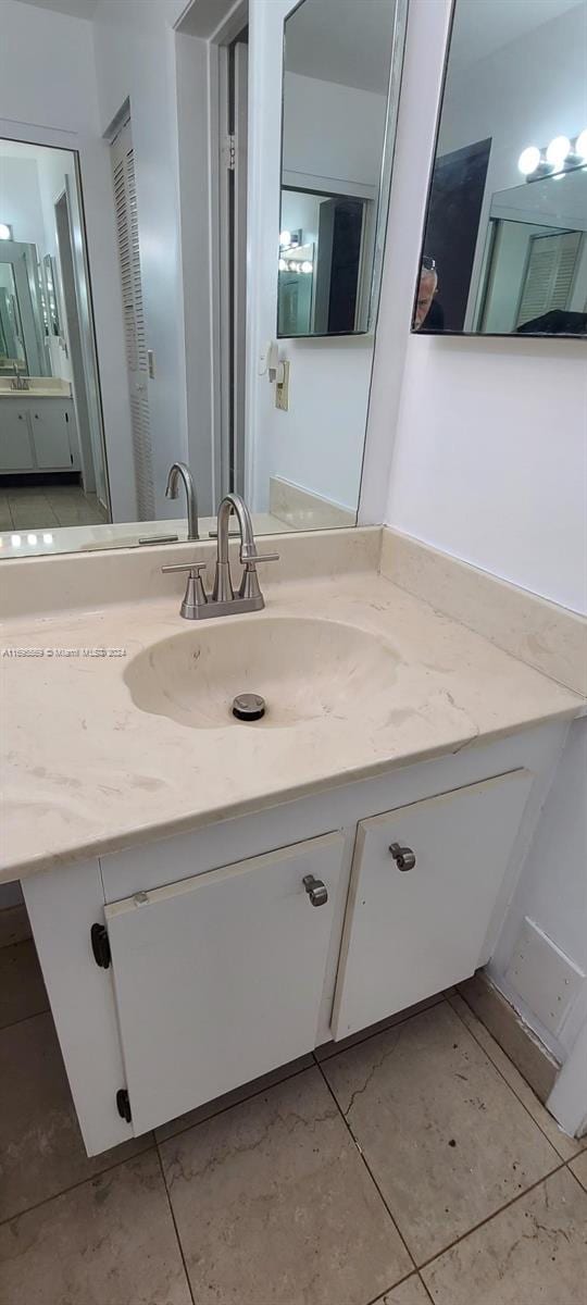 3564 Magellan Cir Unit 211-1, Aventura, FL 33180 - bathroom featuring vanity and tile patterned floors