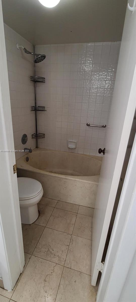 3564 Magellan Cir Unit 211-1, Aventura, FL 33180 - full bathroom with toilet, tub / shower combination, and tile patterned flooring
