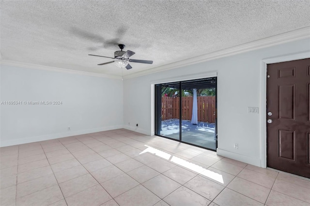 tiled spare room featuring ceiling fan, a textured ceiling, and ornamental molding