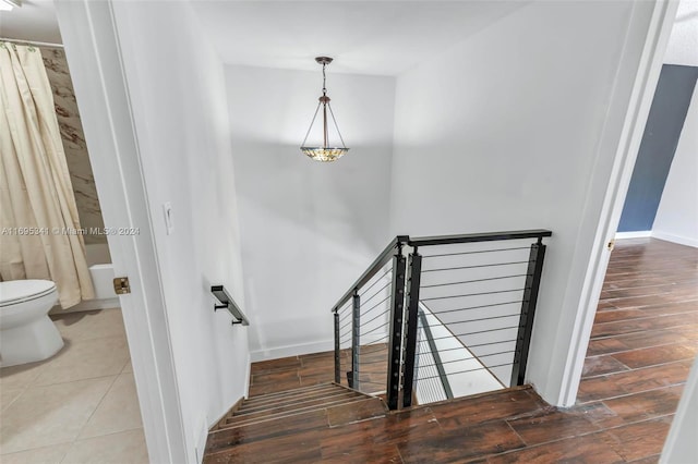 staircase with wood-type flooring