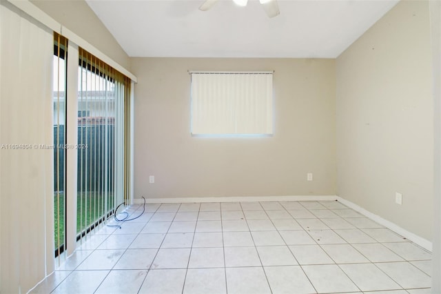 tiled spare room with ceiling fan and lofted ceiling