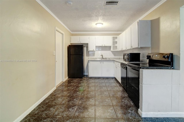 kitchen featuring backsplash, a textured ceiling, sink, black appliances, and white cabinets