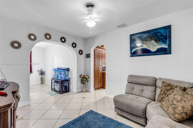 living room featuring ceiling fan and light tile patterned flooring