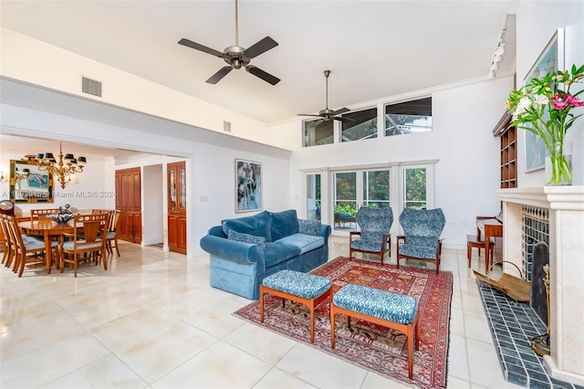 living room with tile patterned floors, ceiling fan, a fireplace, and high vaulted ceiling