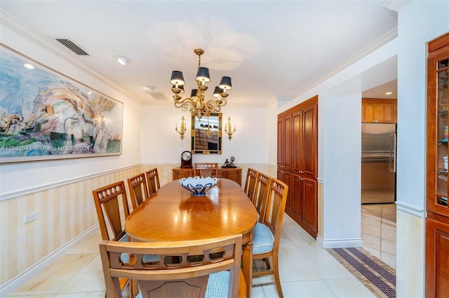 tiled dining space with an inviting chandelier and crown molding