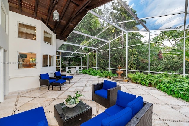 view of patio featuring glass enclosure and an outdoor hangout area