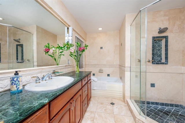 bathroom featuring separate shower and tub and vanity