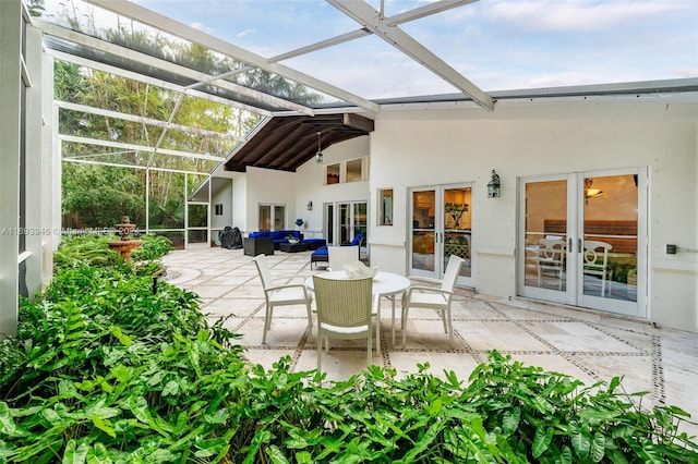 exterior space with french doors and lofted ceiling