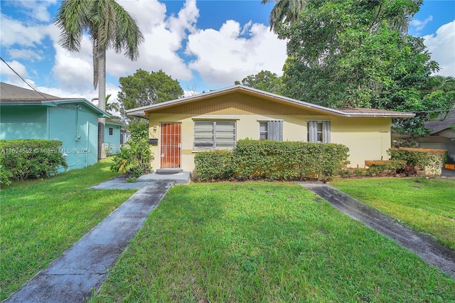 view of front of property with a front lawn