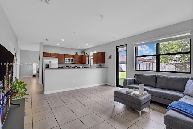 living room featuring light tile patterned flooring