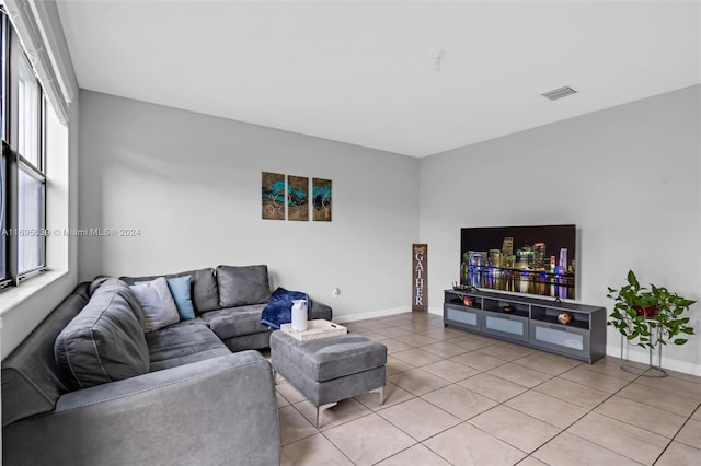 living room with tile patterned flooring