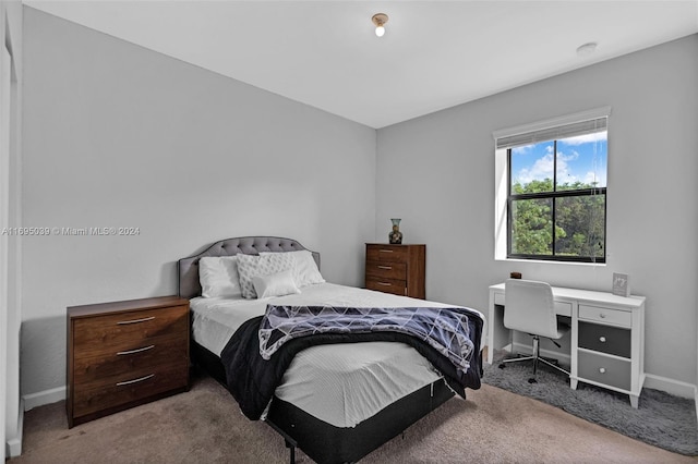 bedroom featuring light colored carpet