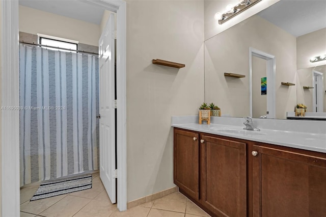 bathroom with tile patterned floors and vanity