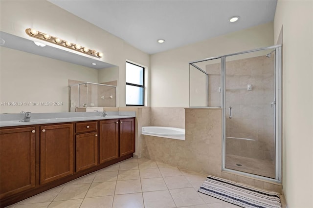 bathroom featuring separate shower and tub, tile patterned flooring, and vanity