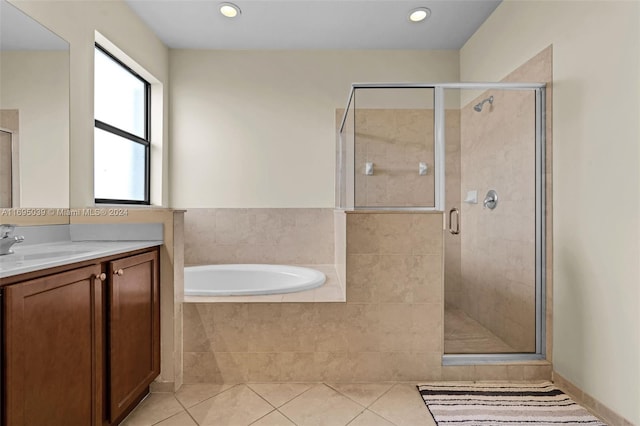 bathroom featuring tile patterned floors, vanity, and independent shower and bath