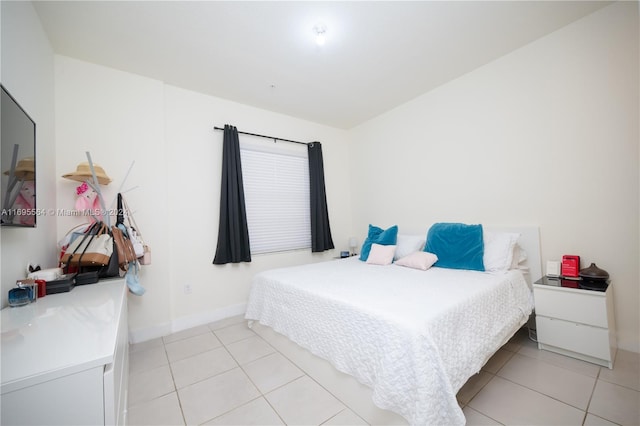 bedroom featuring light tile patterned floors