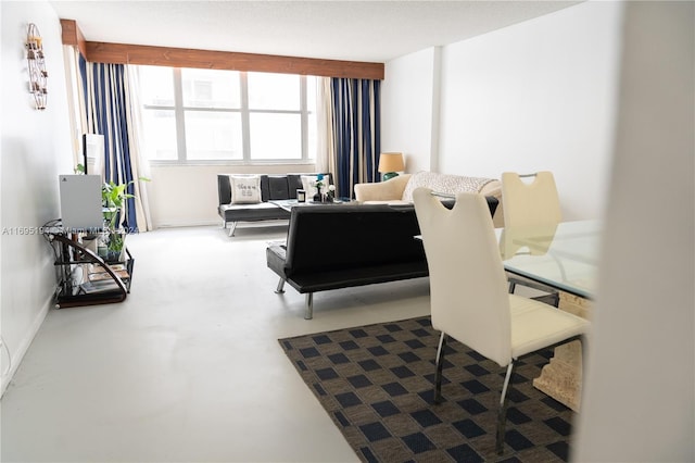 living room featuring concrete flooring