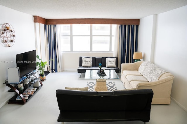 living room featuring a textured ceiling