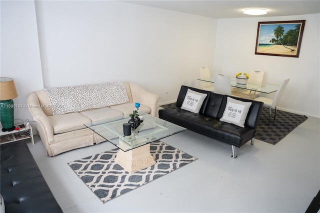 living room with concrete flooring