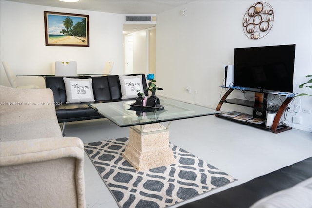 living room with concrete flooring