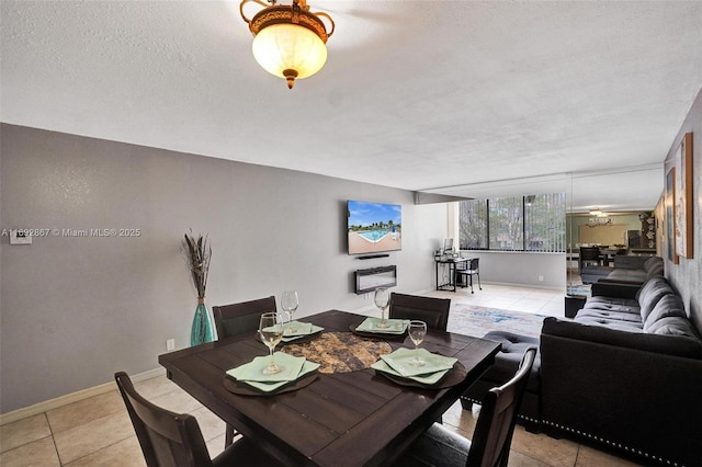 8010 Hampton Blvd Unit 211, North Lauderdale, FL 33068 - dining area with light tile patterned flooring and a textured ceiling