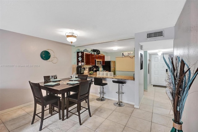 view of tiled dining space