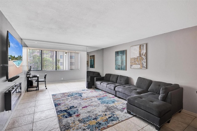 living room featuring light tile patterned floors and a textured ceiling