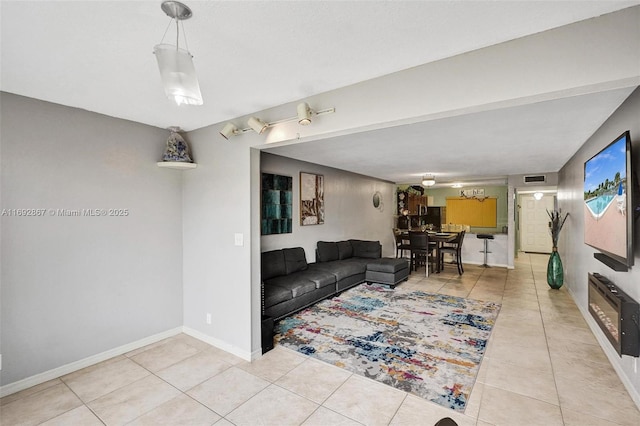 8010 Hampton Blvd Unit 211, North Lauderdale, FL 33068 - living area with light tile patterned floors and baseboards
