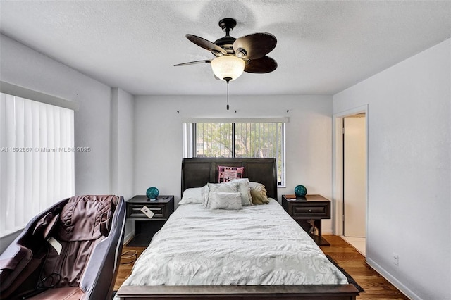 8010 Hampton Blvd Unit 211, North Lauderdale, FL 33068 - bedroom with wood finished floors, a textured ceiling, and a ceiling fan