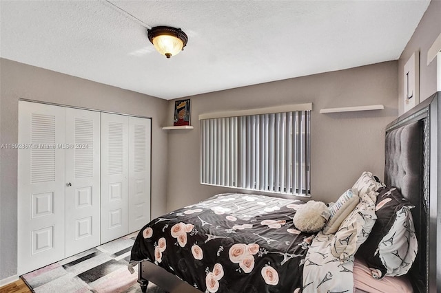 bedroom with a closet and a textured ceiling