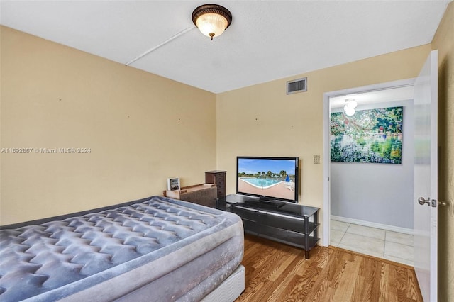 bedroom featuring hardwood / wood-style flooring