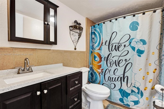 8010 Hampton Blvd Unit 211, North Lauderdale, FL 33068 - bathroom featuring tile walls, vanity, curtained shower, and a wainscoted wall