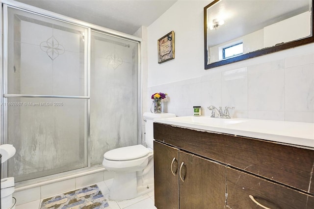 8010 Hampton Blvd Unit 211, North Lauderdale, FL 33068 - bathroom with vanity, a shower stall, tile patterned floors, and tile walls