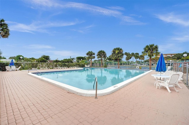 view of swimming pool featuring a patio