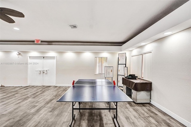 recreation room featuring hardwood / wood-style flooring and ceiling fan