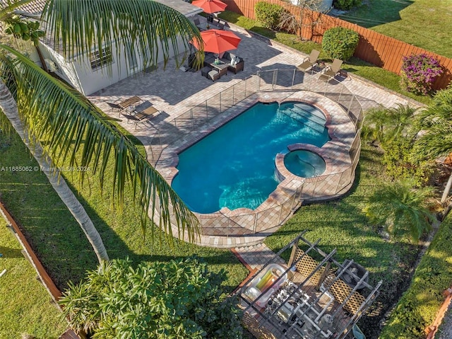 view of pool featuring a patio area and an in ground hot tub