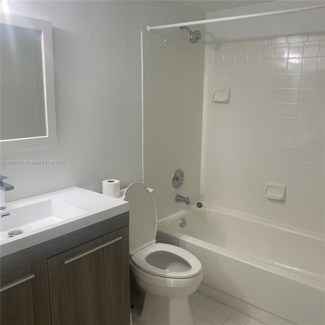 full bathroom with tile patterned flooring, vanity, toilet, and tiled shower / bath