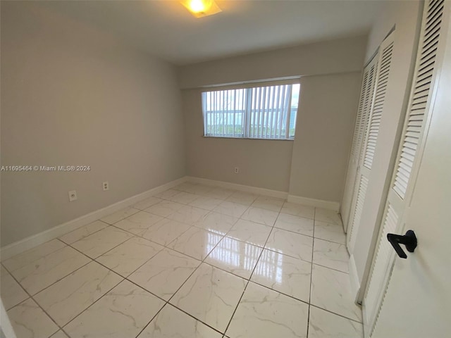 unfurnished bedroom featuring a closet