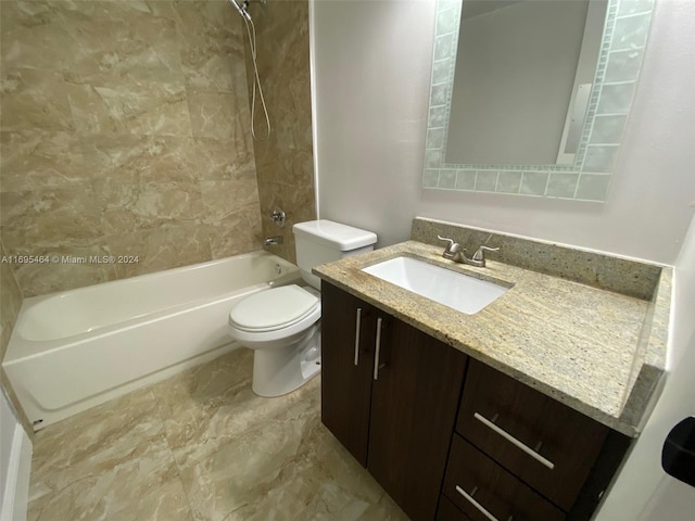 full bathroom with vanity, tiled shower / bath combo, and toilet