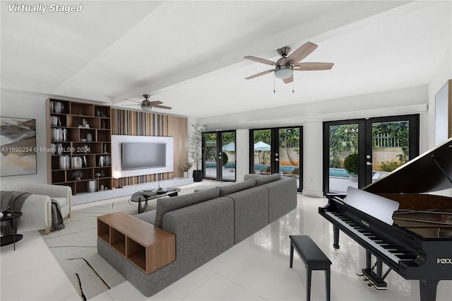 living room with french doors, a wealth of natural light, and ceiling fan