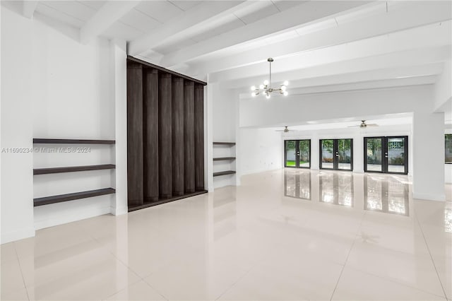 unfurnished room with beamed ceiling, ceiling fan with notable chandelier, light tile patterned floors, and french doors