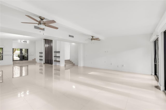 unfurnished living room with french doors, light tile patterned flooring, and ceiling fan with notable chandelier