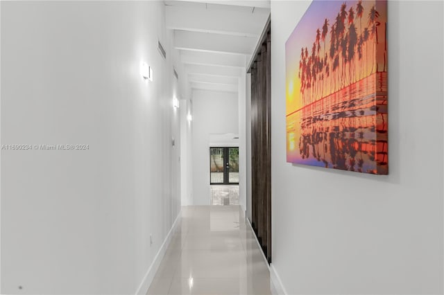 corridor featuring light tile patterned floors