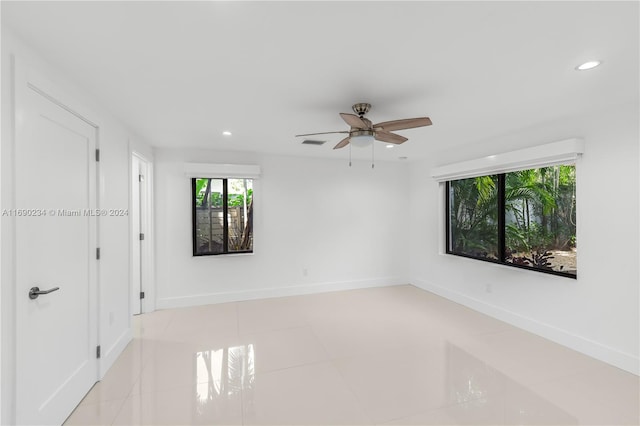 spare room with ceiling fan