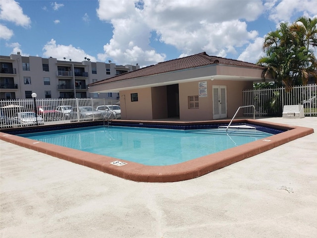 view of swimming pool featuring a patio area