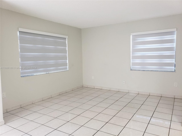 empty room featuring light tile patterned flooring