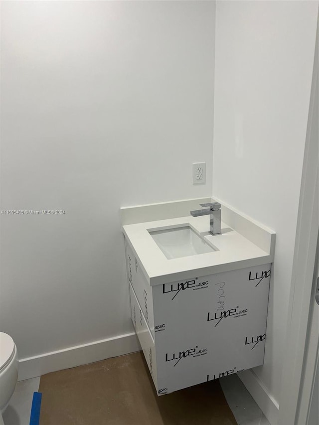 bathroom with toilet and sink