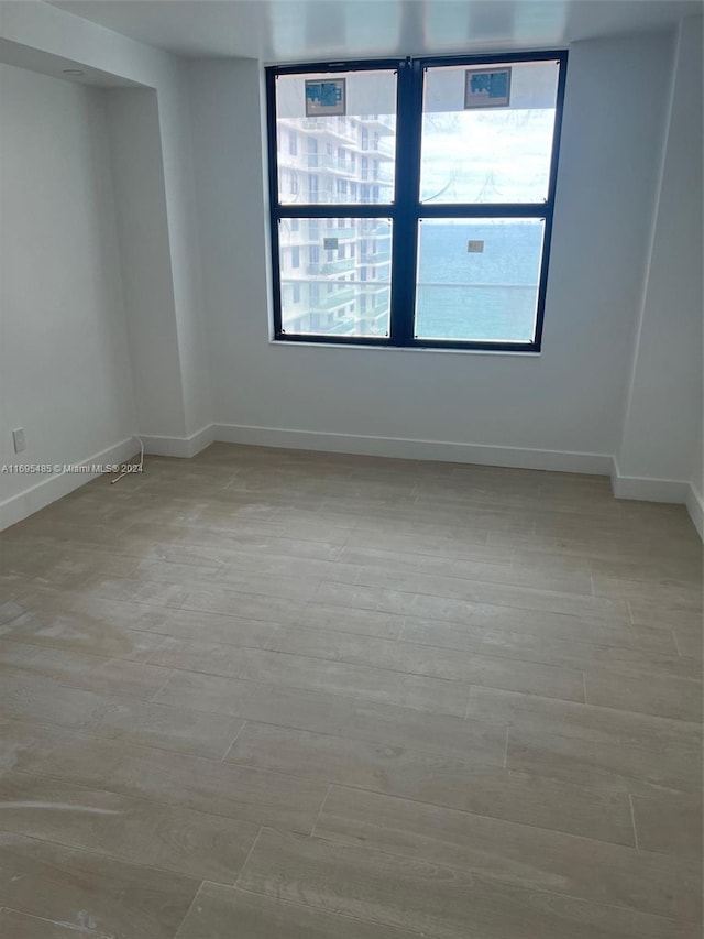 unfurnished room featuring light hardwood / wood-style flooring