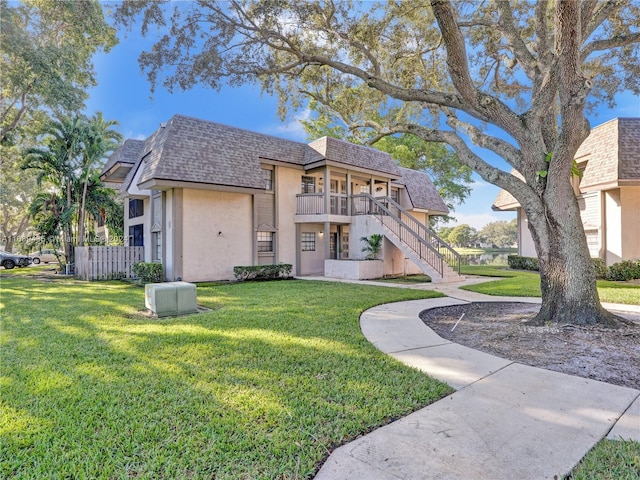 view of front of property with a front lawn